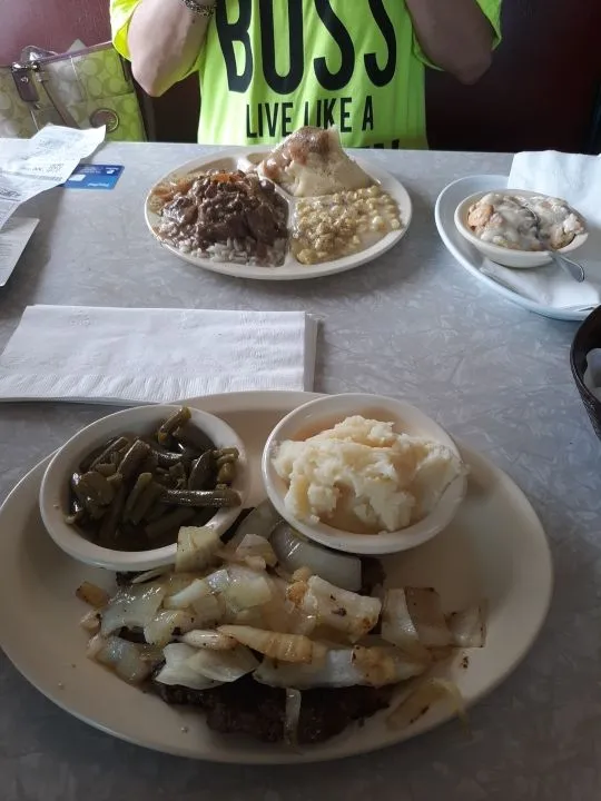 Hamburger Steak an Mashed Potatoes and Gravy an Green Beans Butter Rolls Sweet Tea